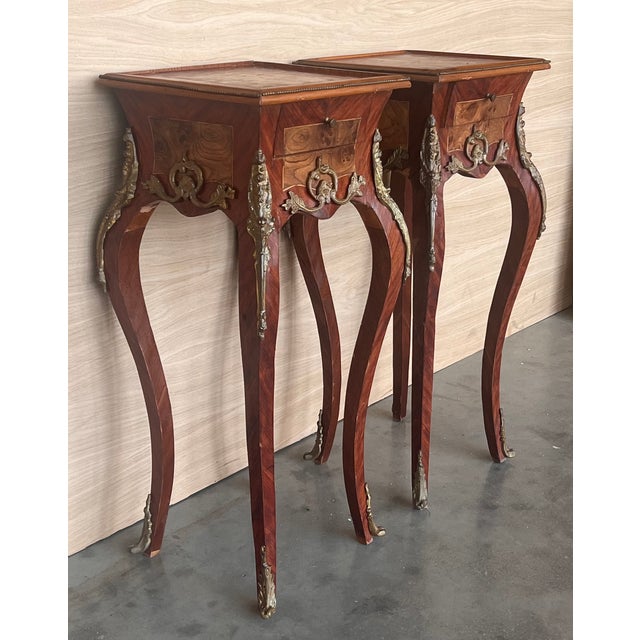 Pair of French Louis XV style nightstands with gorgeous floral and herringbone marquetry, herringbone inlaid box, gilt...