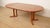 A stunning vintage round extendable dining table from the renowned danish manufacturer dyrlund, crafted from warm and...