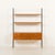 This freestanding mid-century shelving unit comes from italy, from the 1970s, and is made with richly grained teak....