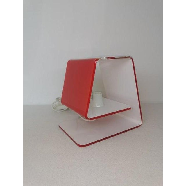 Modern Italian red design table lamp Carina - Marco Baxadonne for Calligaris luce Carina, table lamp made with a simple...