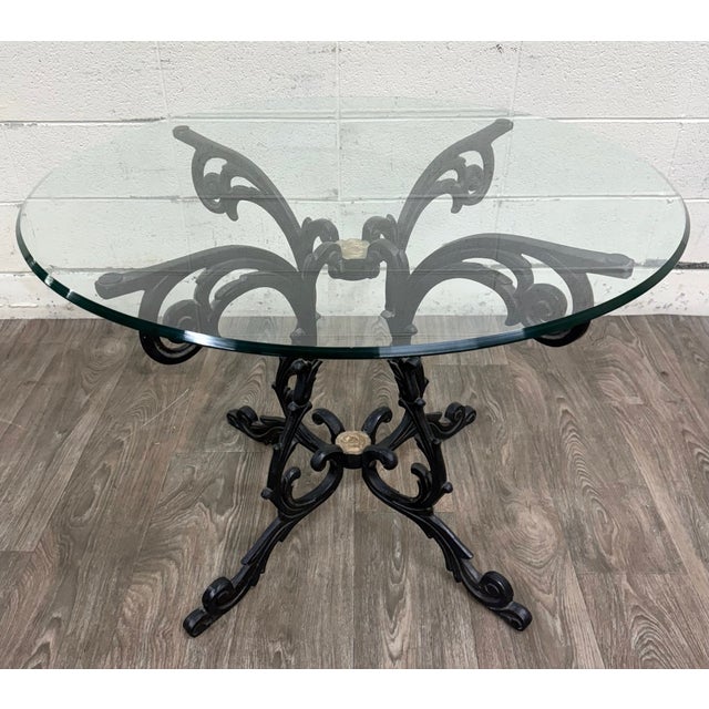 This is a stunning vintage Hollywood Regency style wrought iron and glass center table, occasional table, or breakfast...