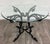 This is a stunning vintage Hollywood Regency style wrought iron and glass center table, occasional table, or breakfast...