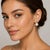 18k White gold earring with two 16mm South Sea Pearls and two natural yellow diamonds weighing 0.64 carats and round...