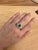 This emerald perfectly captures the pure green glow of the legendary Muzo mine in Colombia. Standing tall at 1.7 carats,...
