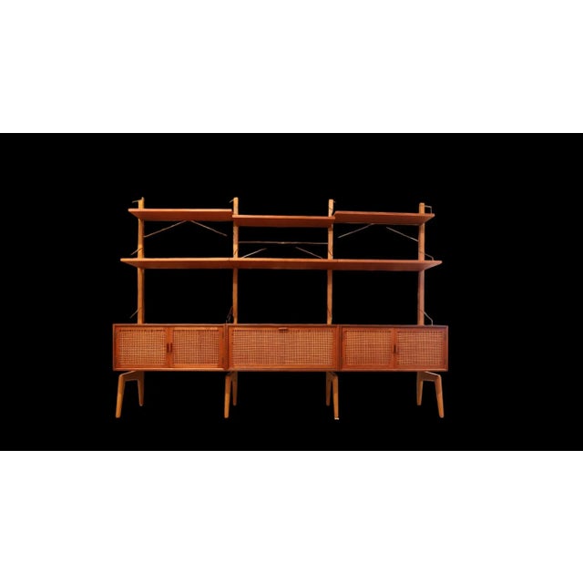 A wonderful floor standing shelf system designed by Ingolf Bahus and manufactured by Gusten Bahus Eftr. A/S in Norway! The...