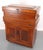 Antique tool cabinet made of pine with two sections and swivels on casters. The recessed upper tier features a hinged...
