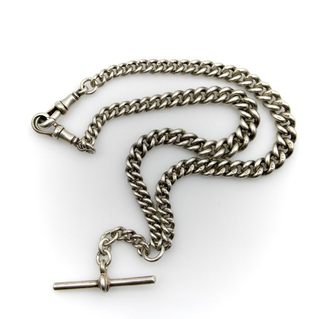 This sterling silver graduated curb link chain is an example of a very-well made Art Deco watch chain, made by Herbert...
