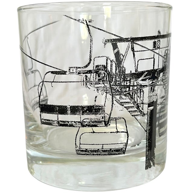 A wonderfully graphic pair of vintage ski-themed cocktail glasses, decorated with a wraparound black-and-white...