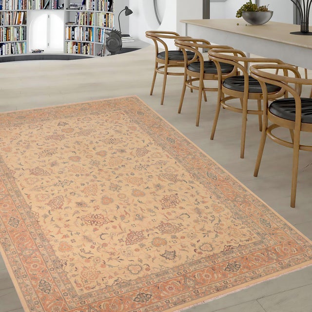 Enhance the ambiance of your home with this magnificent Persian-influenced Turkish hand-knotted rug made by skilled...