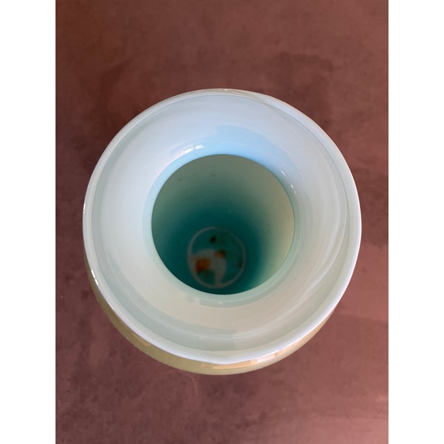 Green glass vase with rounded body, light blue rim, white interior, h 27 cm, 20th century