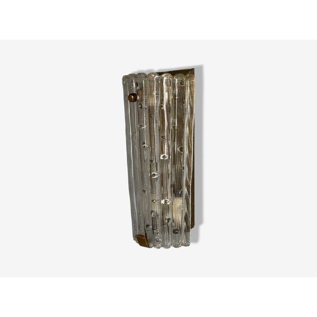 Carl Fagerlund, Orrefors, Textured Glass, Brass, Large Wall Sconce, Sweden, 1940s A large textured glass wall light on a...