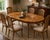 A beautifully refinished vintage oval dining table by American Furniture Company, showcasing timeless American...