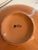 A large Italian ceramic serving bowl by Netas, featuring a beautifully detailed hand-painted tomato vine motif with rich...
