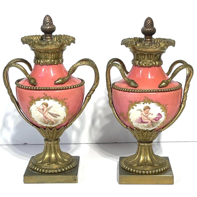 A 19th-century pair of French Sèvres-style porcelain cabinet vases executed in the Louis XVI taste, circa 1880, with rose...