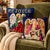 A pair of vintage Christmas needlepoint pillows featuring angels against deep navy blue backgrounds. One depicts an angel...