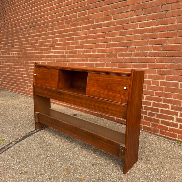 Designed by Kipp Stewart for Drexel’s Declaration collection, this full-size walnut headboard blends clean mid-century...