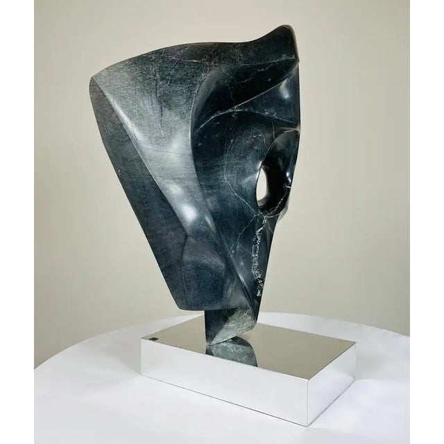 A stunning and rather large abstract sculpture in dark green stone in the manner of Henry Moore. Beautiful organic lines...