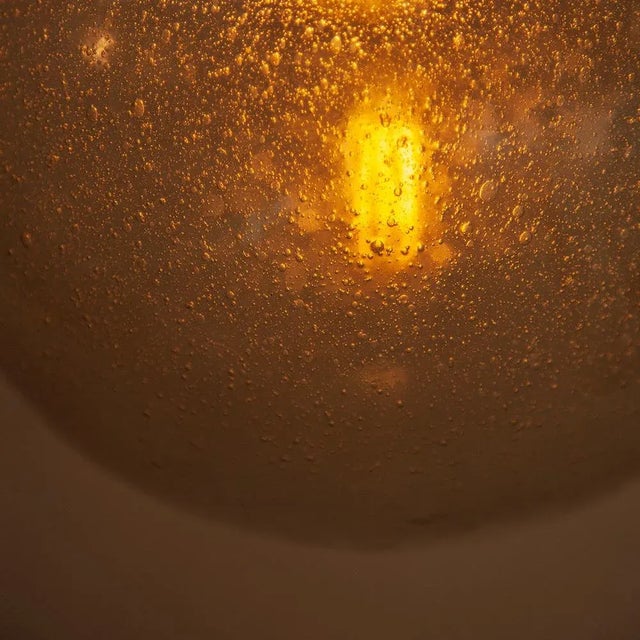 Pair of spherical glass lamps, 35cm diameter each, made by Limburg Glashutte in the 70s. The glass is slightly smoky and...