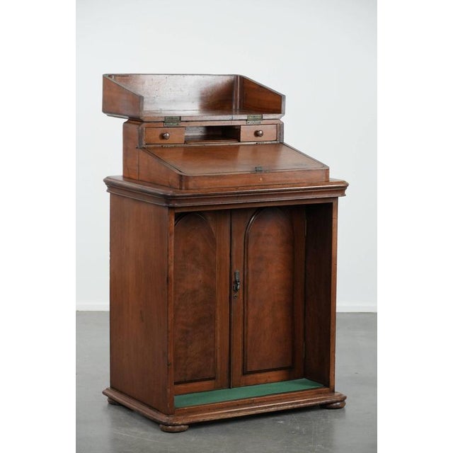 We are offering this beautiful and antique standing desk/counter/English writing desk from the 19th century with an...