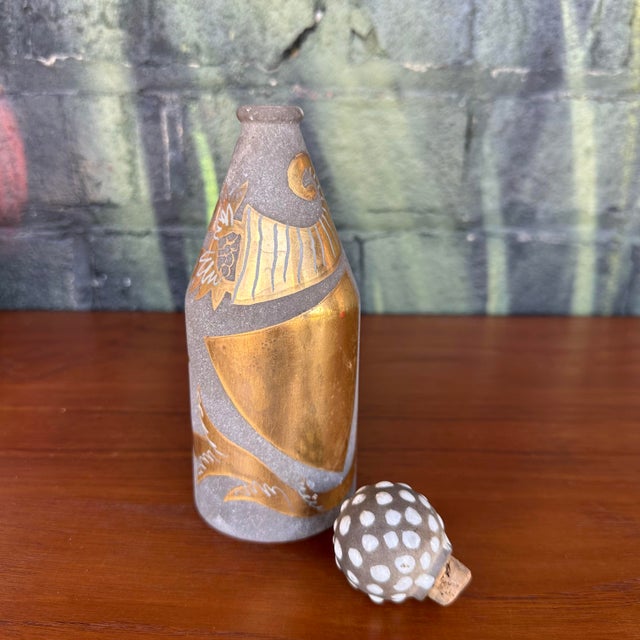 This is a vintage Old Spice bottle upcycled by Waylande Gregory. It features a stone gray and metallic gold art-deco...