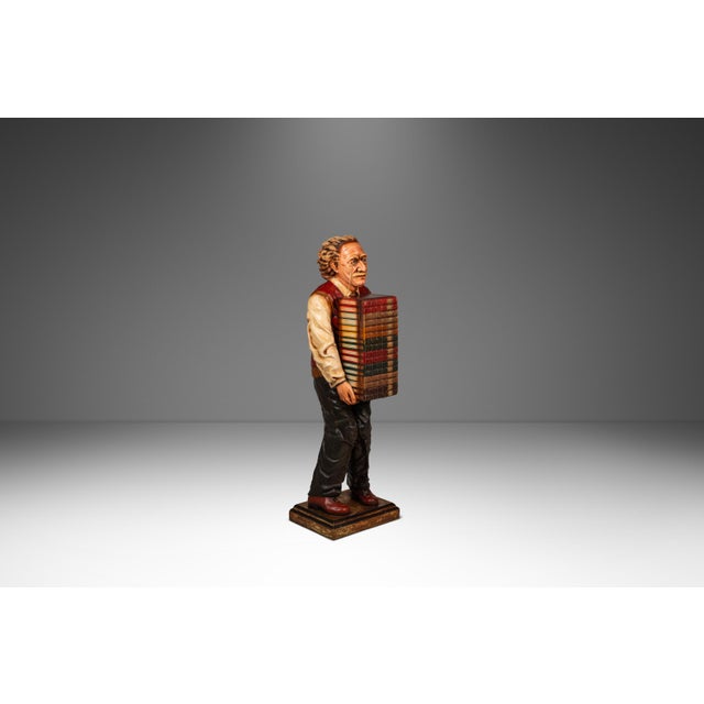 Introducing a rare, hand-made sculpture depicting the iconic theoretical physicist Albert Einstein carrying a large stack...