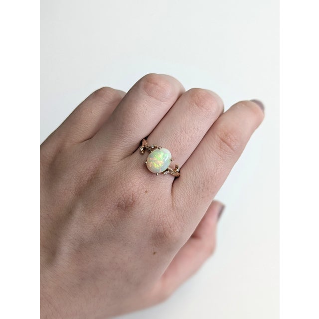 Graceful and glowing, this nature-inspired ring features a luminous 1.87ct Ethiopian opal framed by diamond accents in a...
