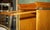 Antique Modular Honey Oak and Gilt Brass Stacking Bookcase with Glazed Retracting Doors For Sale - Image 17 of 18