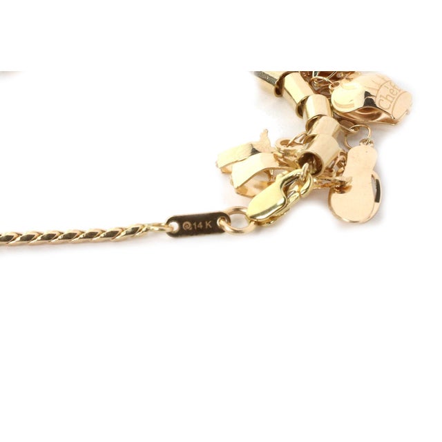 Late 20th Century 14k Yellow Gold 13 Dangling Multi-Charms Chain Bracelet For Sale - Image 5 of 5