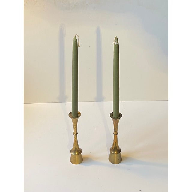 A pair of solid brass candlesticks designed and manufactured by jens harald quistgaard - ihq in denmark during the 1960s....