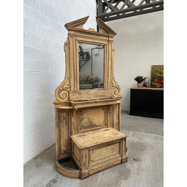 This magnificent Napoleon III period mirror has retained its original patina. It has a small chest under the mirror for...
