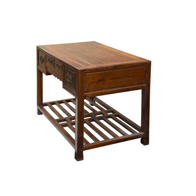 This classic Ming-style Elmwood writing desk features a four-drawer facade adorned with detailed, vintage-finished bronze...