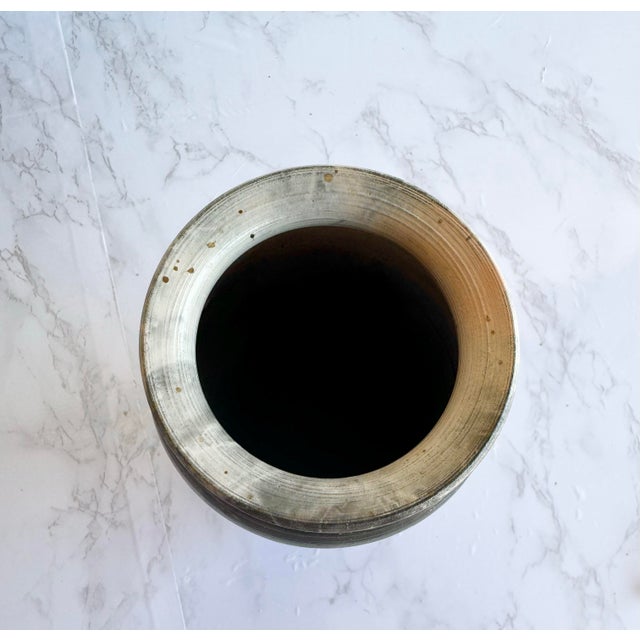 This stunning handcrafted raku pottery vase, signed and dated 1997 (possibly J. B...?), showcases the horsehair raku...