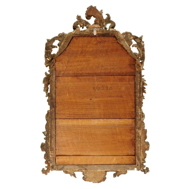 Beautifully carved and wonderfully timeworn, this 18th-century Italian Rococo mirror showcases sweeping scrolls, acanthus...