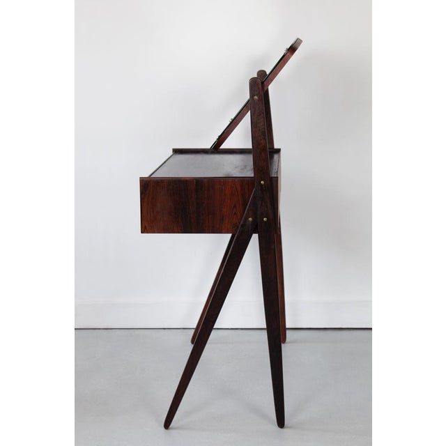 An elegant and very sweet rosewood dressing table, designed by Arne Vodder for Oelholm Moebelfabrik in 1950, with spilt...