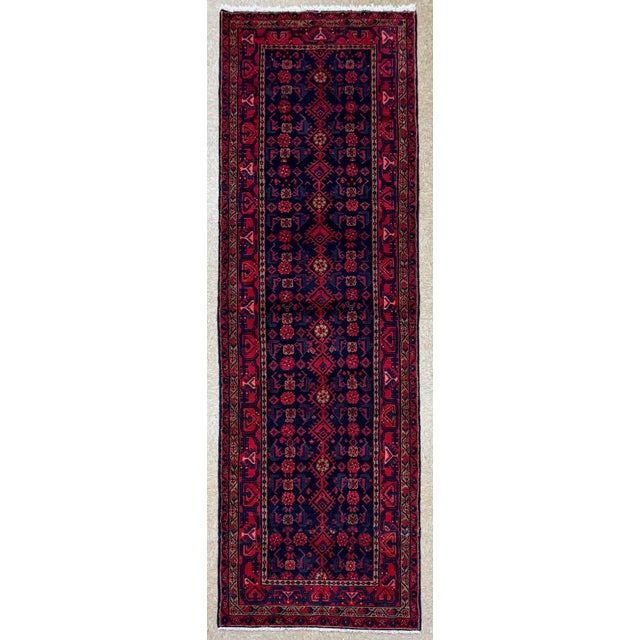 Hand-knotted long runner from the Hamadan region of western Iran, featuring an allover geometric lattice design set within...