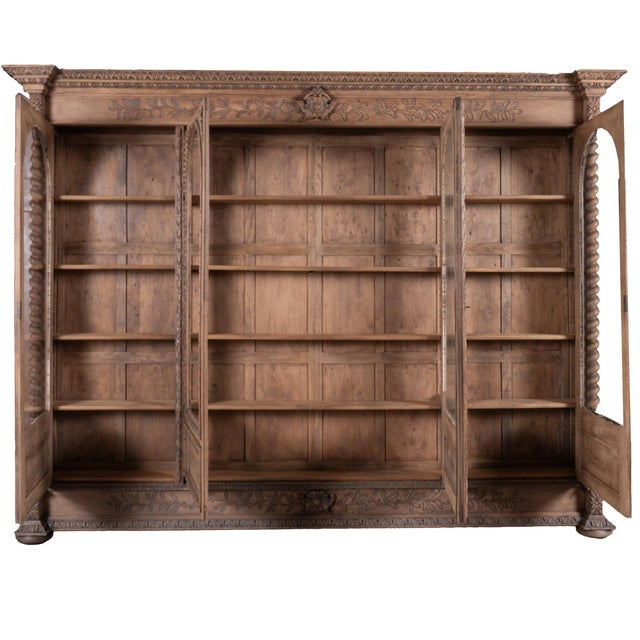 19th-century large French bookcase crafted in bleached French oak. This impressive display cabinet features extensive...