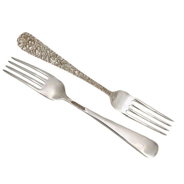 A handsome pair of Kirk Stieff Rose Pattern sterling silver luncheon forks, beautifully decorated with the celebrated...