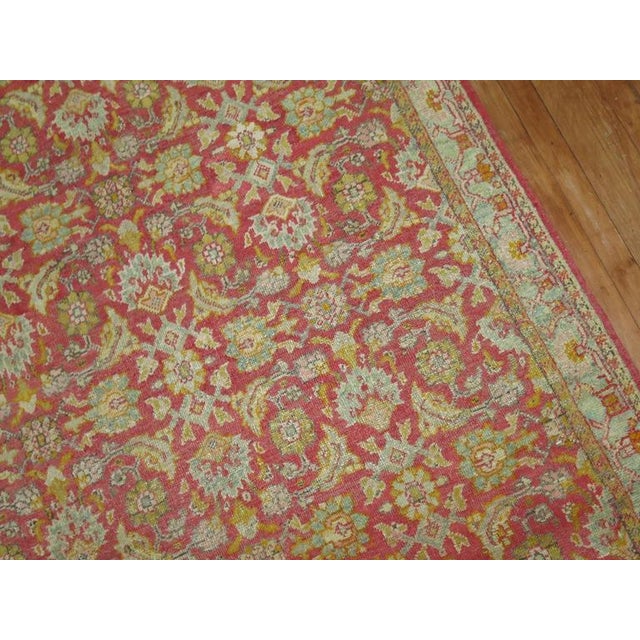 A Turkish rug with a Herati motif you typically find in antique Persian rugs. Red field, icy blue border with accents of...