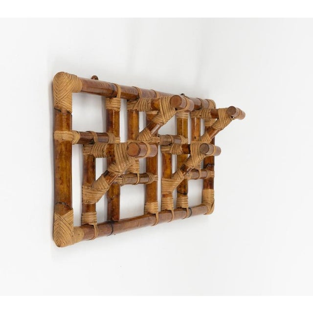 Midcentury beautiful rectangular coat rack in bamboo and rattan featuring four hooks in the style of Vivai Del Sud. Made...
