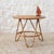 Vintage round coffee table with three curved legs. The legs are bamboo, and the circular tabletop is made of particleboard...