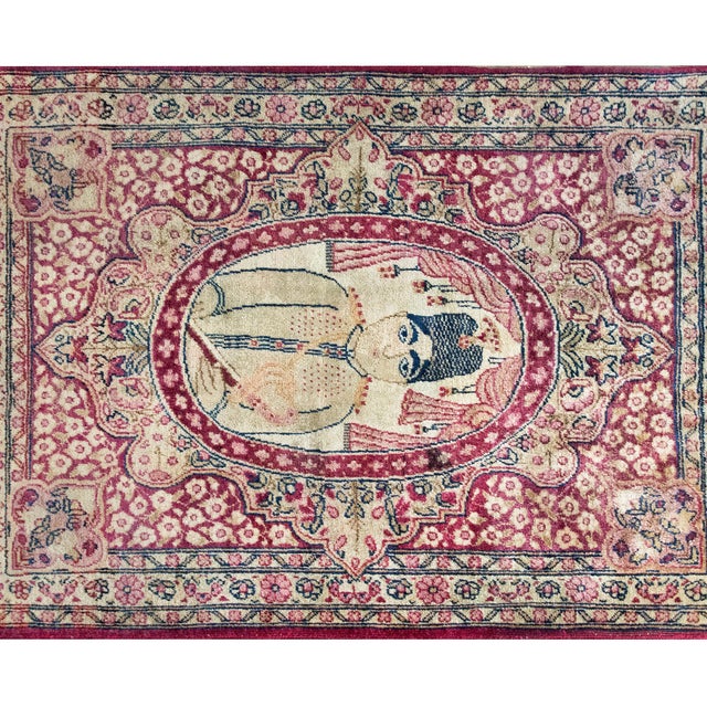 A wonderful early 20th century Persian Pictorial Lavar Kirman rug depicting a portrait of a gentleman in the center,...