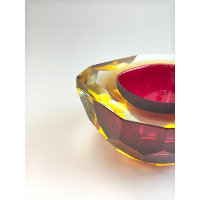 A finely crafted murano glass bowl, produced in the 1960s on the venetian island of murano, long celebrated for its...