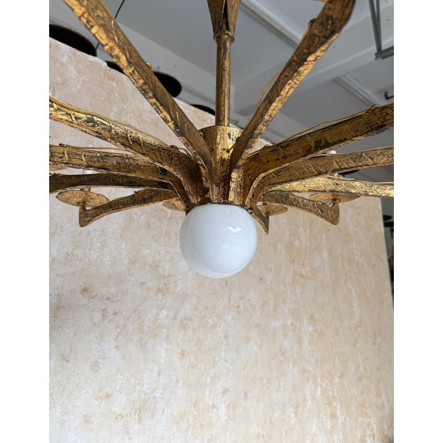 Spanish 1950’s Gilt Iron Twelve-Arm Chandelier With Opaline Glass Center Light For Sale - Image 17 of 18