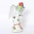 Charming life size porcelain parrot hand decorated in vivid tropical colors, glazed and perched on a tree trunk. Signed...