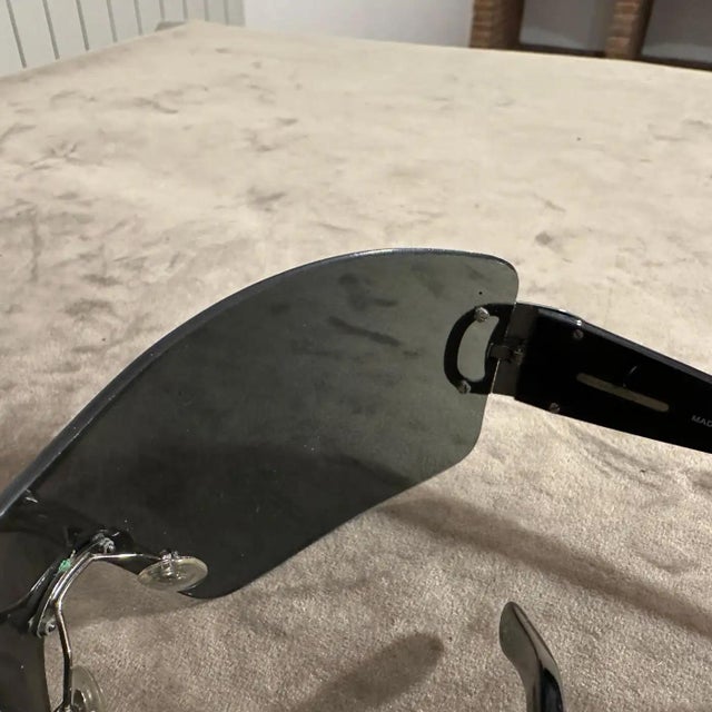 These 1990s vintage Ferragamo oversized mask sunglasses are a striking example of bold, futuristic eyewear from the era....