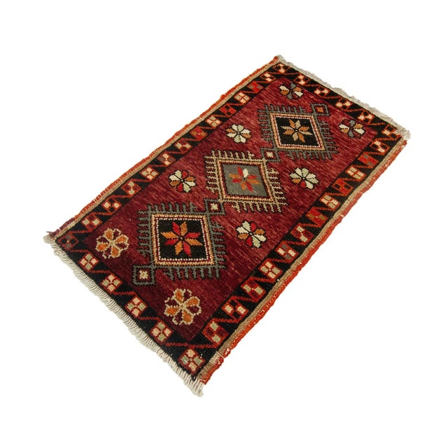 Vintage Handknotted decorative mini rug from Kars region of Turkey. Approximately 45-55 years old. In very good condition.