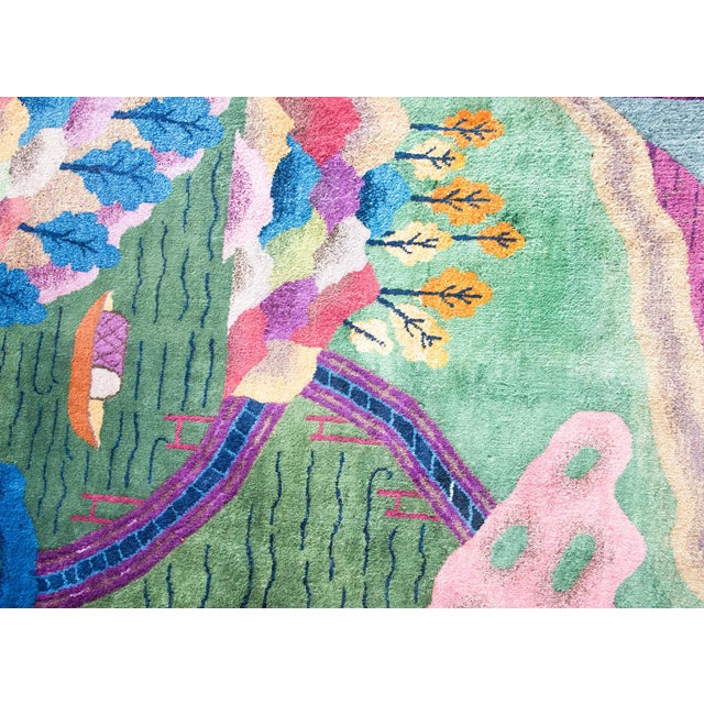This early 20th-century Chinese Art Deco rug features a boldly imaginative garden landscape rendered in a vivid,...