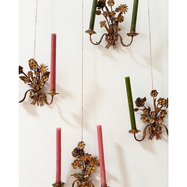 A beautiful and unusual set of four early 20th century French wall sconces. Designed for using candles to light up the...