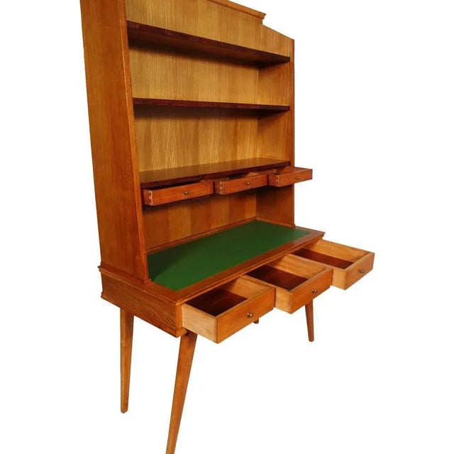 - Mid-century desk with bookcase in maple - Designed in the style of Ico Parisi - Produced in the 1950s - Features a green...