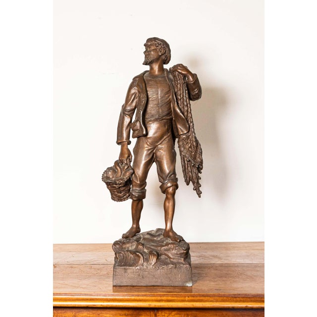 This 19th-century French bronze statuette captures the hardworking spirit and naturalism of rural life during the late...